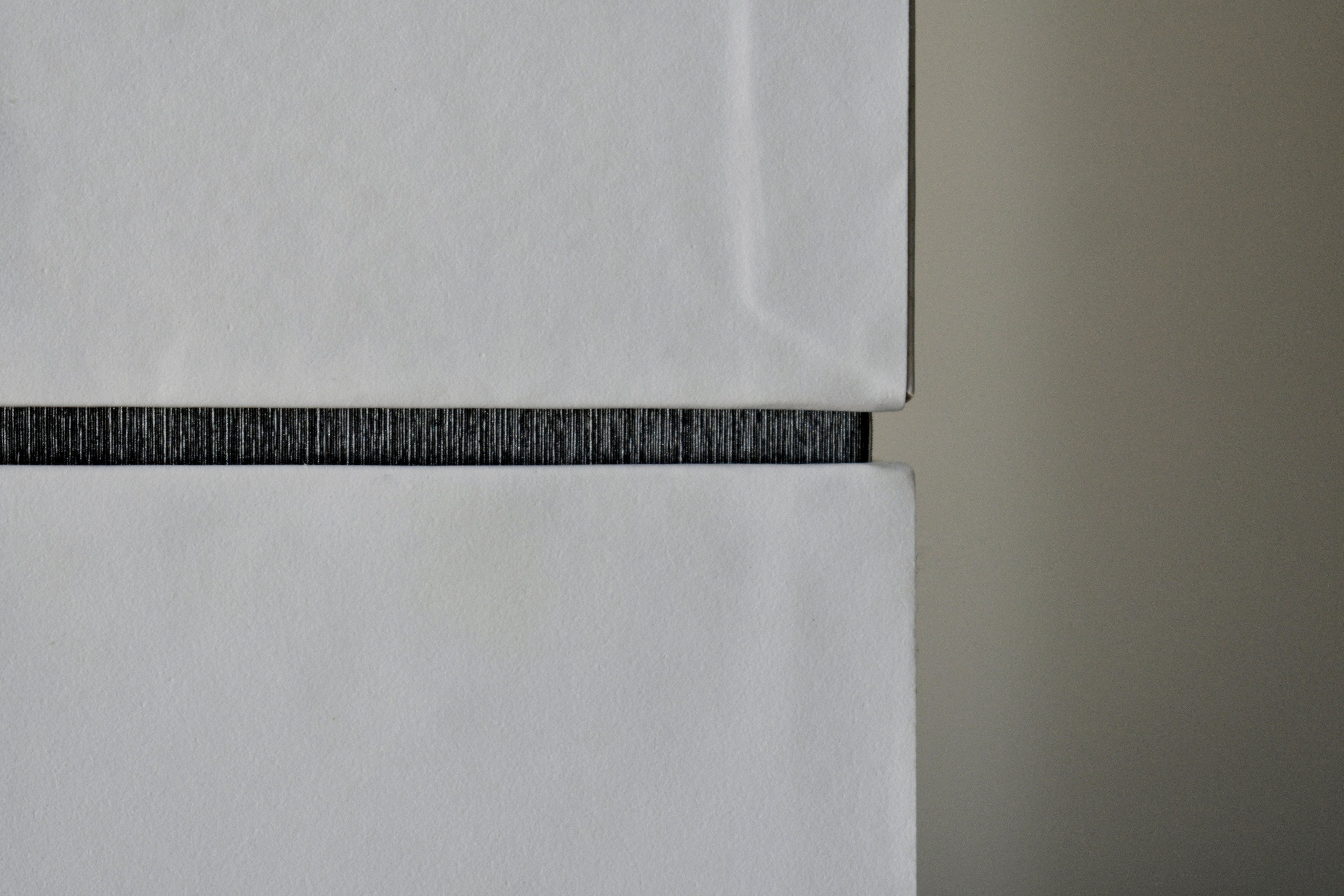 Anders brand wordmark in white placed on top of an image of a modern interior design.